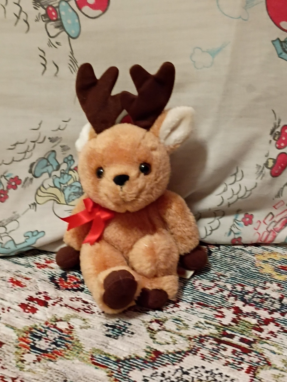 Russ Plush Reindeer in Light Brown with Dark Brown Antlers and Red Bow